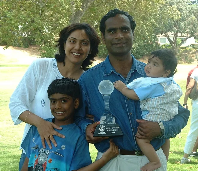 Murali Theegala with his family and golf trophy, showing young Sahith Theegala